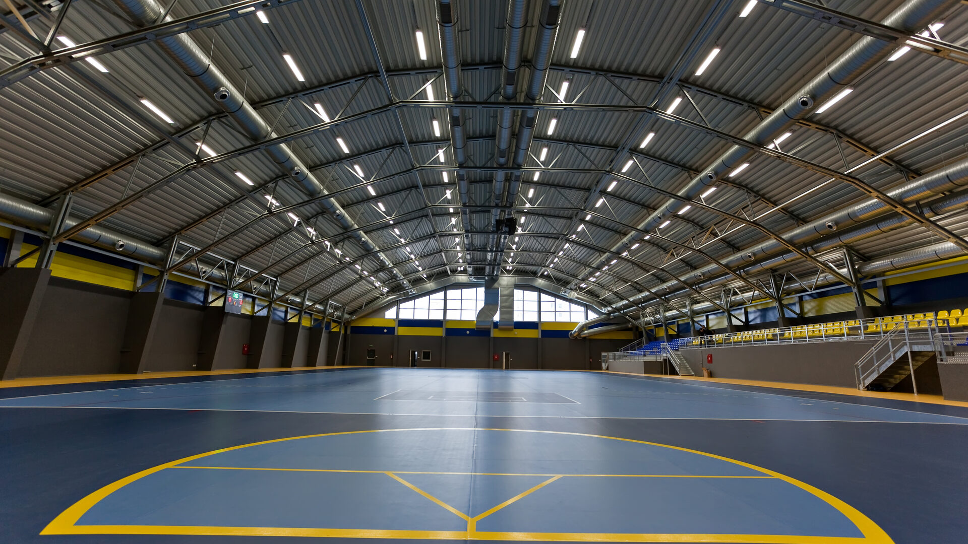 Gymnasium lit with high bay LED fixtures